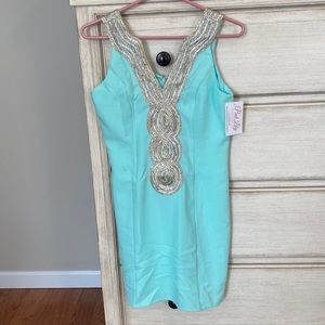 Pretty turquoise dress with gold and silver accents
